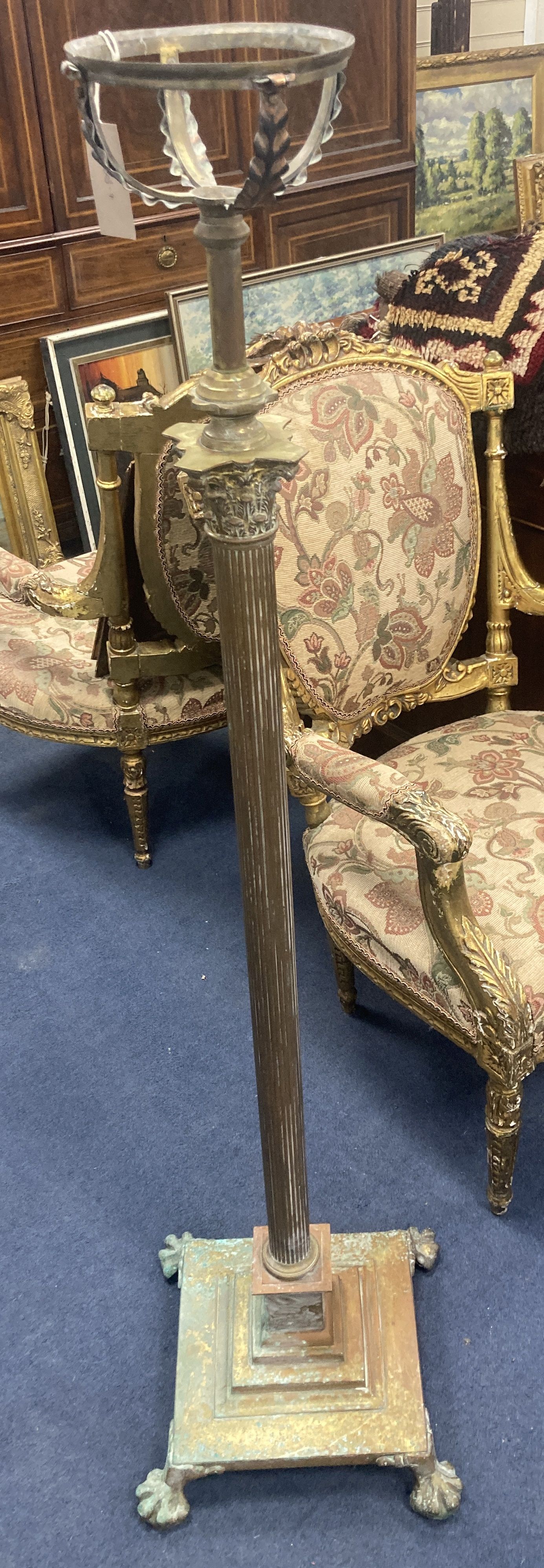 An Edwardian Corinthian column brass adjustable oil standard lamp, minimum height 140cm